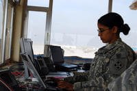 A military air traffic controller tracks flights coming in and out of Camp Taji Airfield in Iraq.